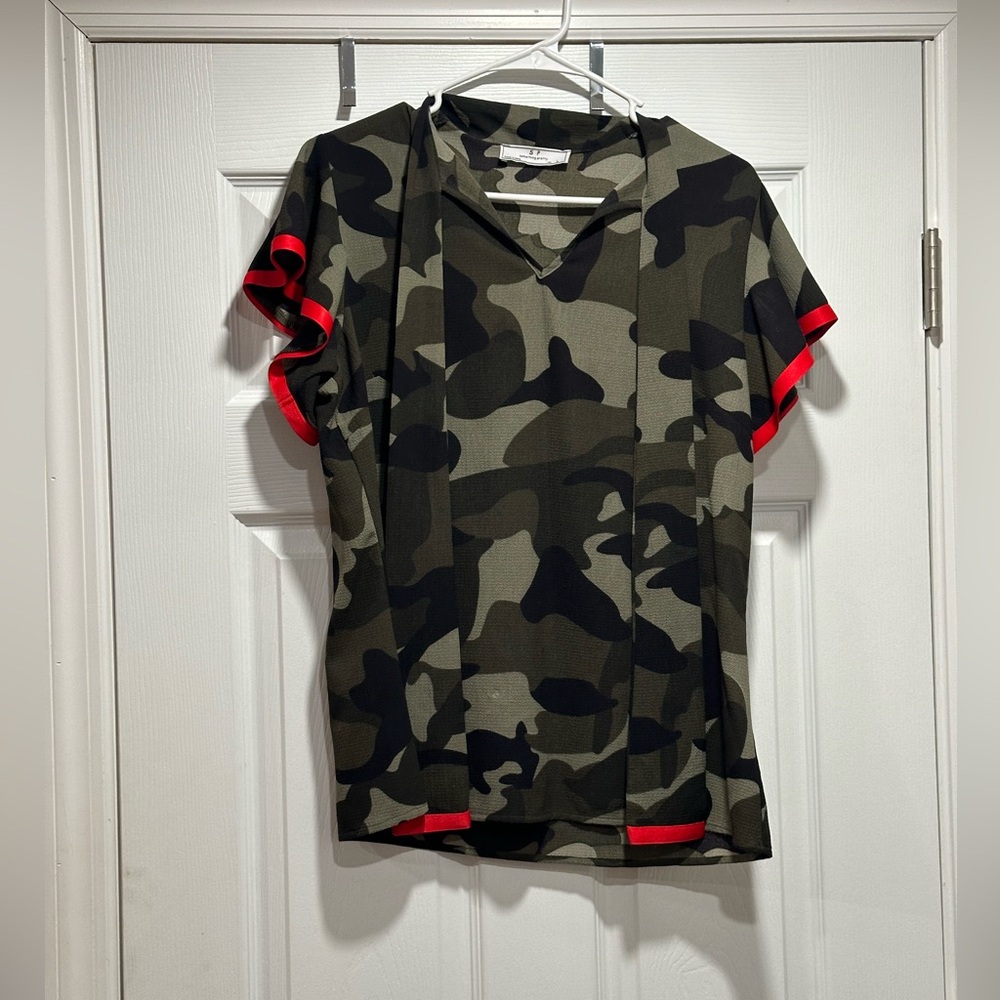 Camouflage shirt with red trim.